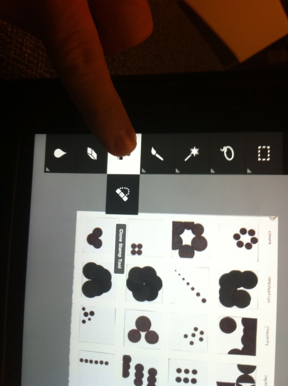 To edit out pins, magnets, or small blemishes, use the clone stamp tool.