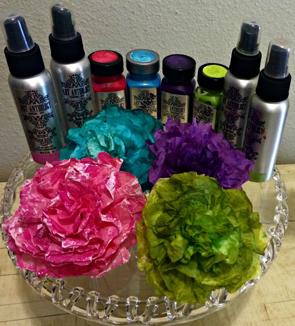 To enhance the colors of my flowers, I used coordinating colors of Colorations Sprays and also some Gesso on the top edges of the pink flower. Just have fun with them and experiment with color.