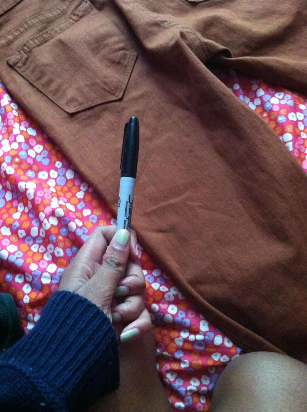 To ensure your shorts turn out even, you can use the sharpie to draw lines guiding you where to cut. Completely optional.