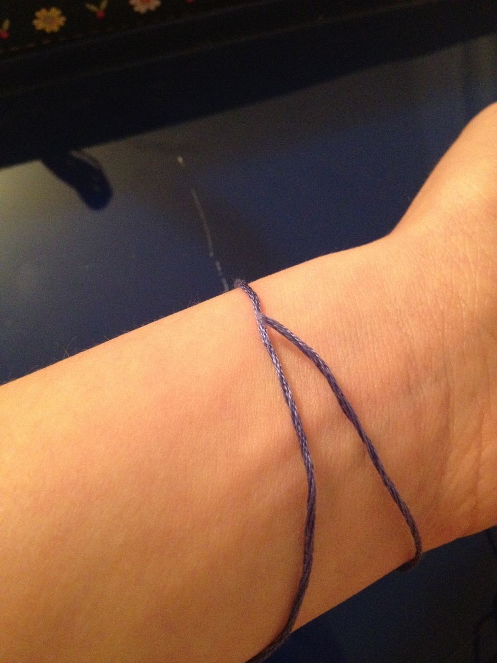 To find out how much string you're going to need for your wrist, wrap the type of string you want around it, and add 3 inches more of length to it. Then do the same to a different string.