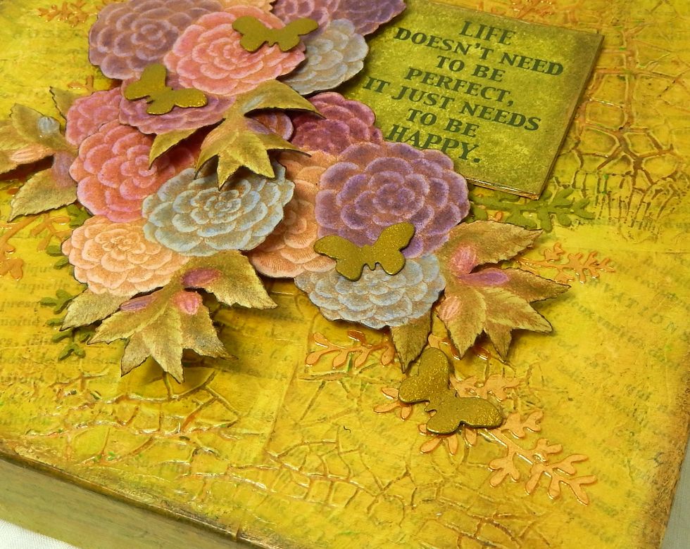 To finish, layer up your moulded flowers over the stencilled ferns. Add some little gold butterflies and a coordinating sentiment.