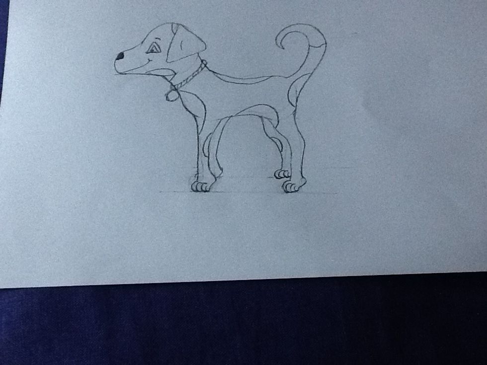 To finish off, rub out lines and add details like a collar, spots, patches ect.. Now you have a dog that you can colour in later or leave as your own dog cartoon!