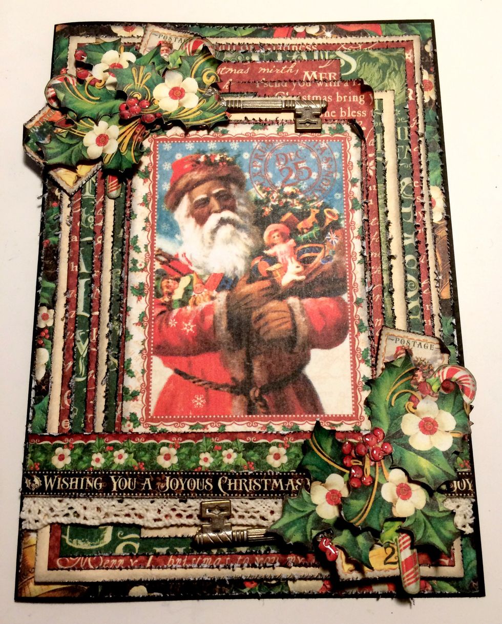 To finish the outside of the card, add glossy accents to the holly berries. Set the card aside to allow the glossy accents to dry. Your card is now finished.