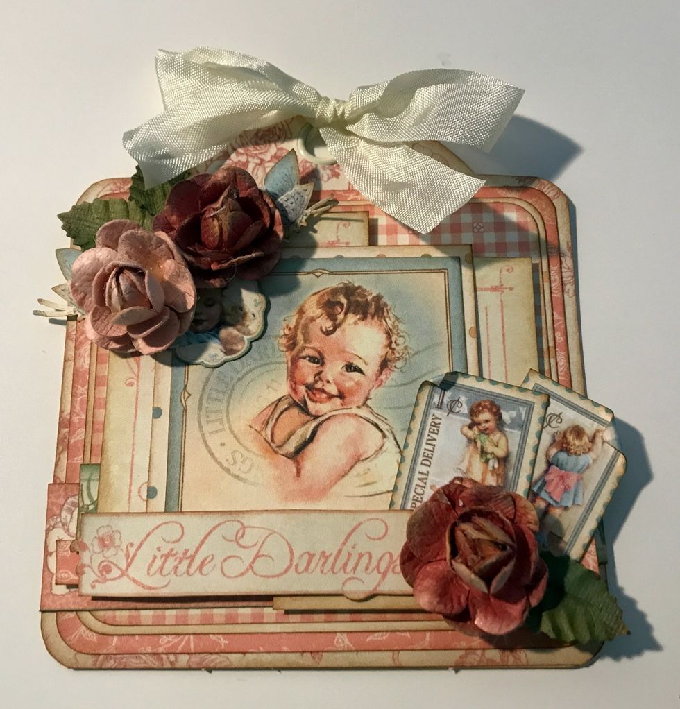 To finish the top of the tag, add a cream bow.
