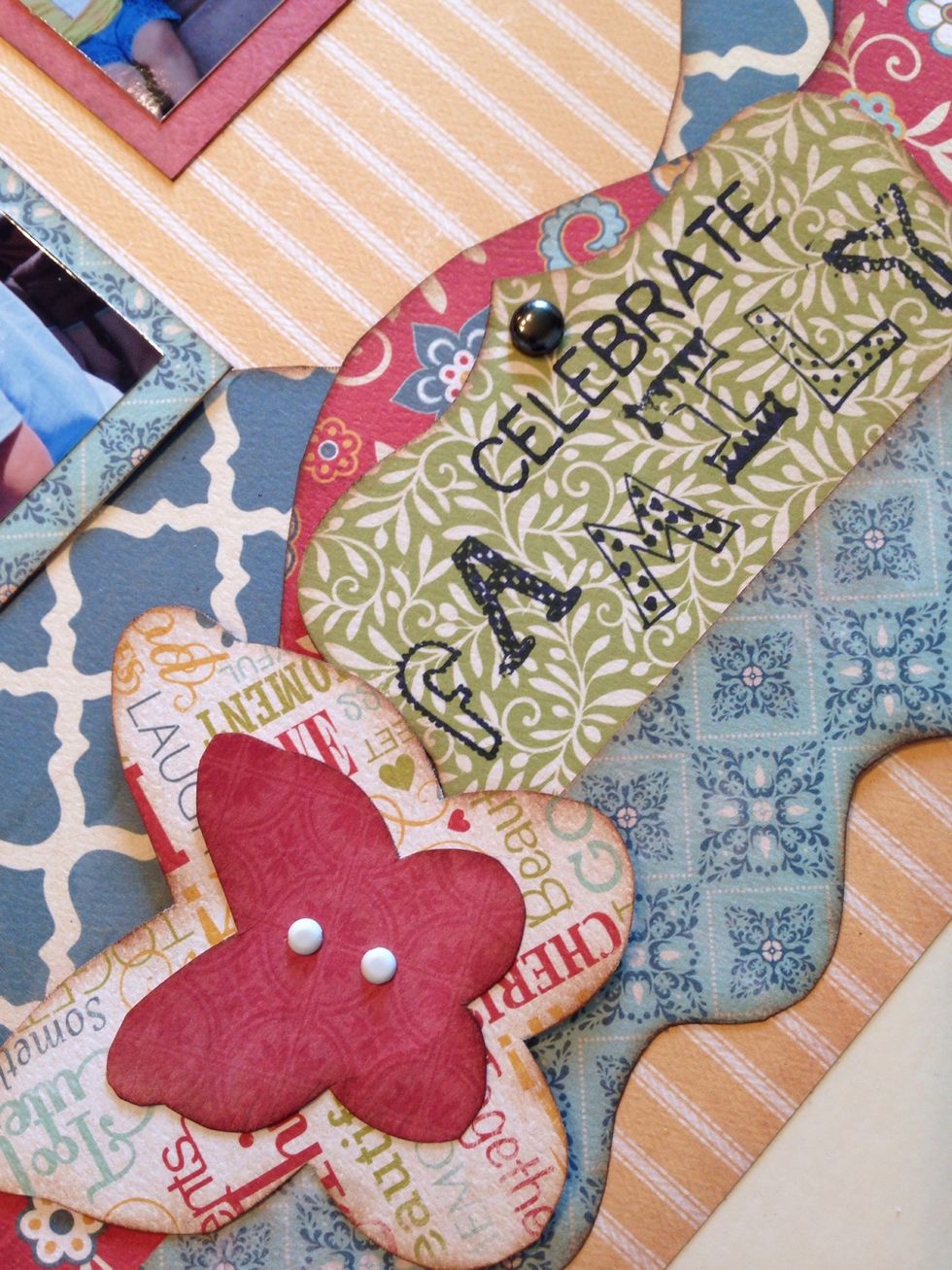 To finish your page, add some small embellishments like brads and buttons.