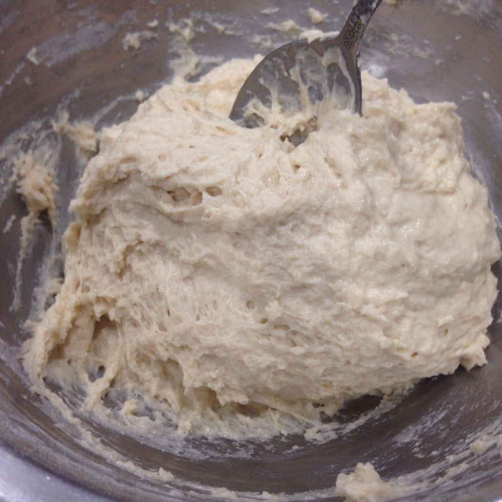 To form a loose sticky dough that pulls away from the sides of the bowl.