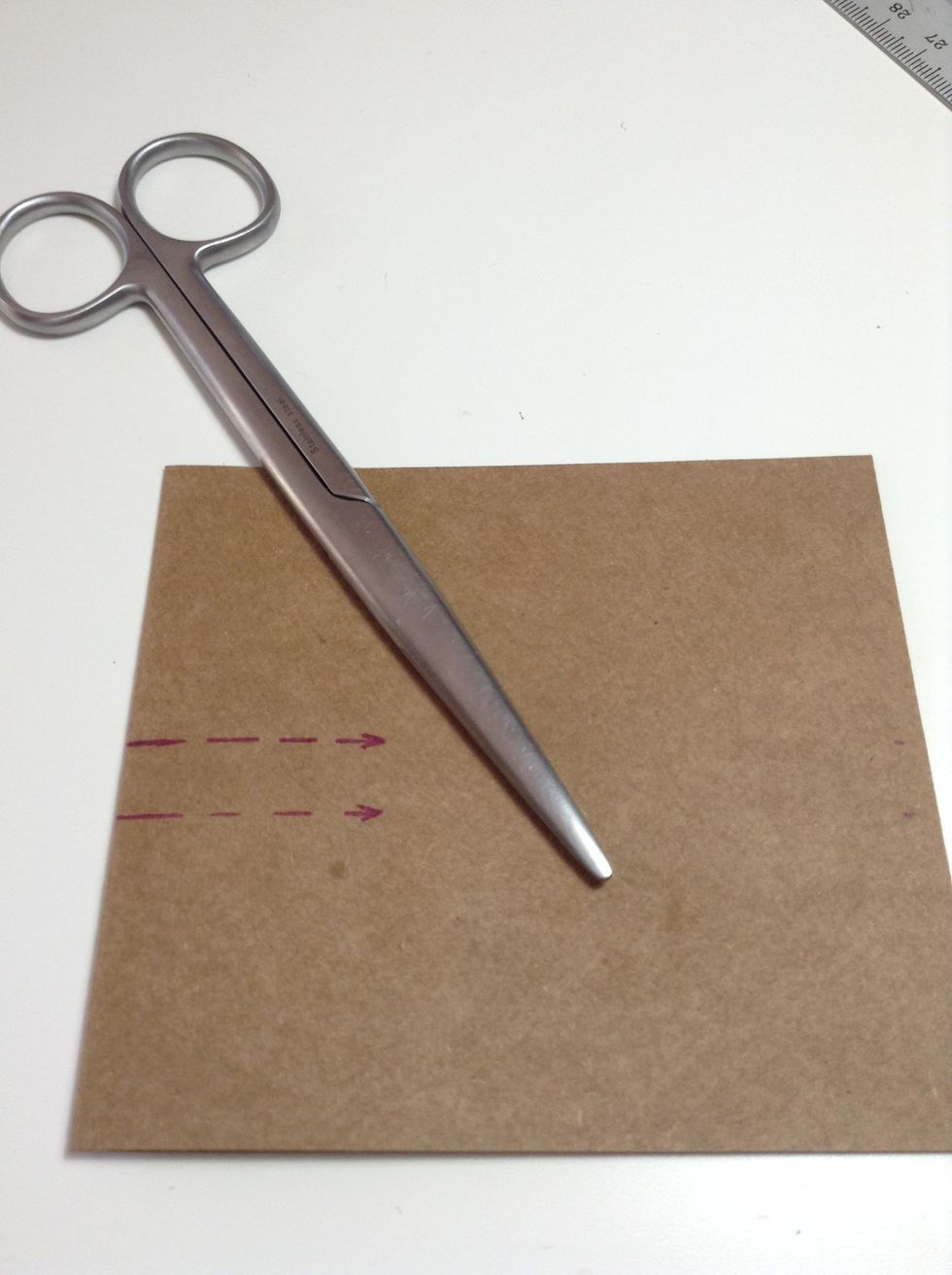 To form the pop-up steps/platforms, you will cut parallel slits from the folded edge of the card kraft.