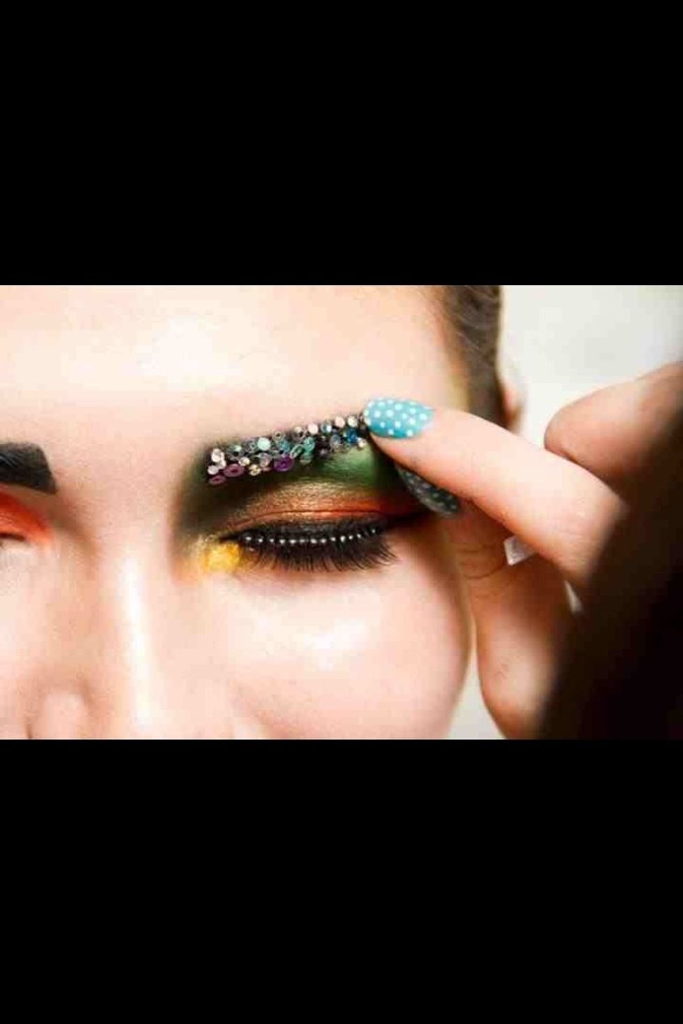 To get amazing sequin eyebrows I used spirit gum to apply sequins carefully with a tweezer. This takes time and patience.