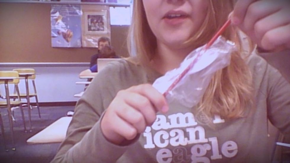 to get it out you must poke a hole in the plastic