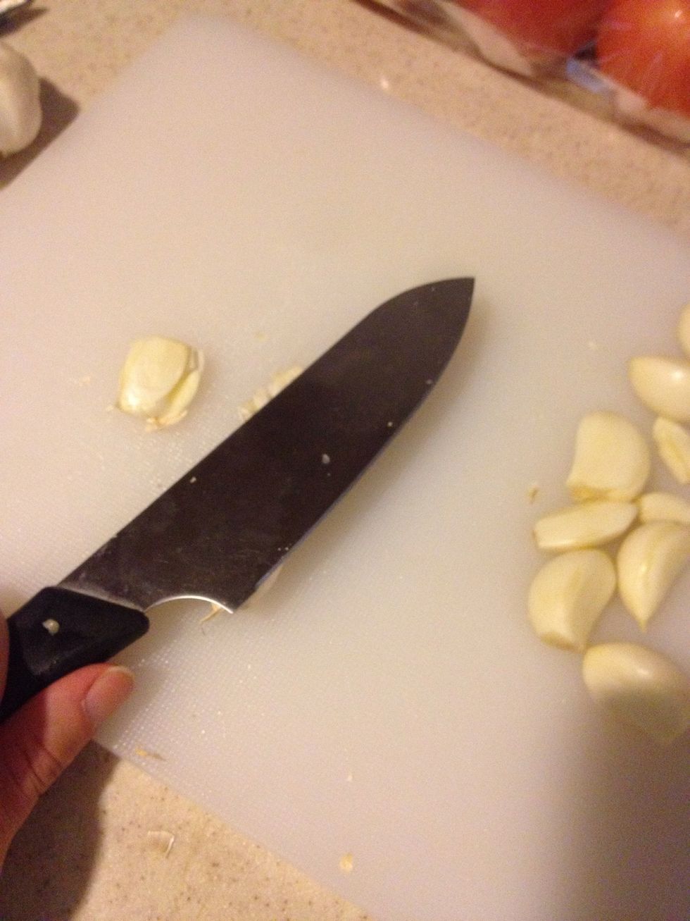 To get rid of the skin. Pres the garlic with knife.