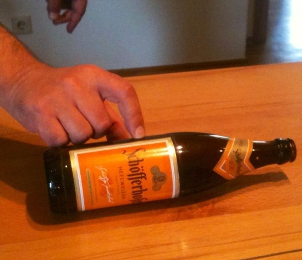 To get the yeast out of the bottle, roll the bottle on a table.