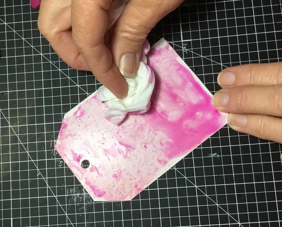 To give a mottled effect, dab off excess colour with a tissue.