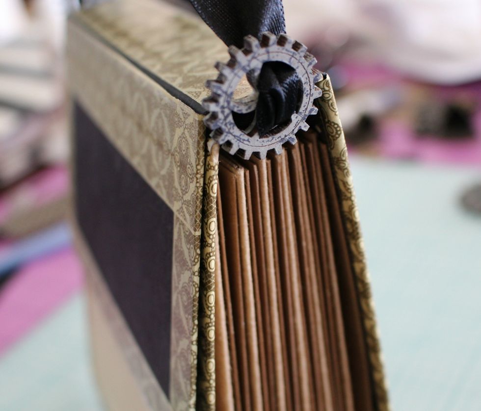 To give more detail.. I use one gear on each side of the ribbon to use it as a handle.