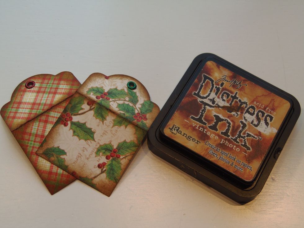 To give tags a vintage look you can ink the edges using distress ink.  This technique brings out all the colors in the paper.