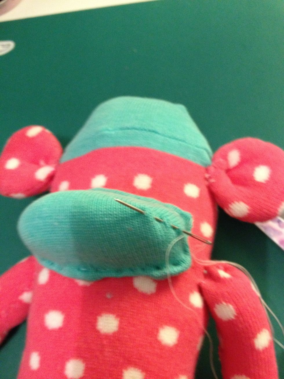 To give your sock monkey a smile, sew across the finished mouth.