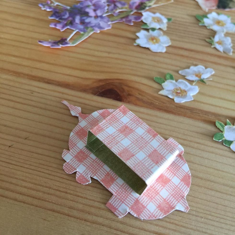 To glue the birdcage glue a piece of paper as shown.