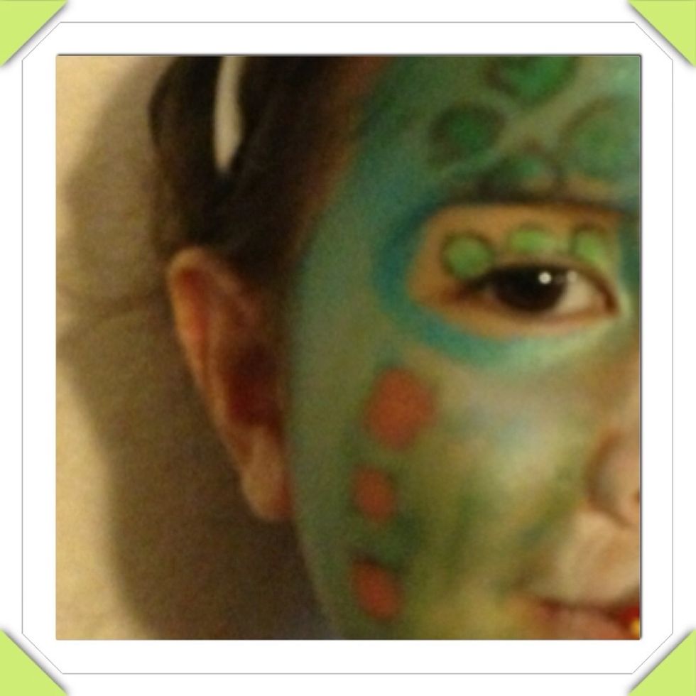To go with St. Patricks theme and Candy crush, we colored the face with Ireland's flag color green, white, orange. The squares are from candy crush