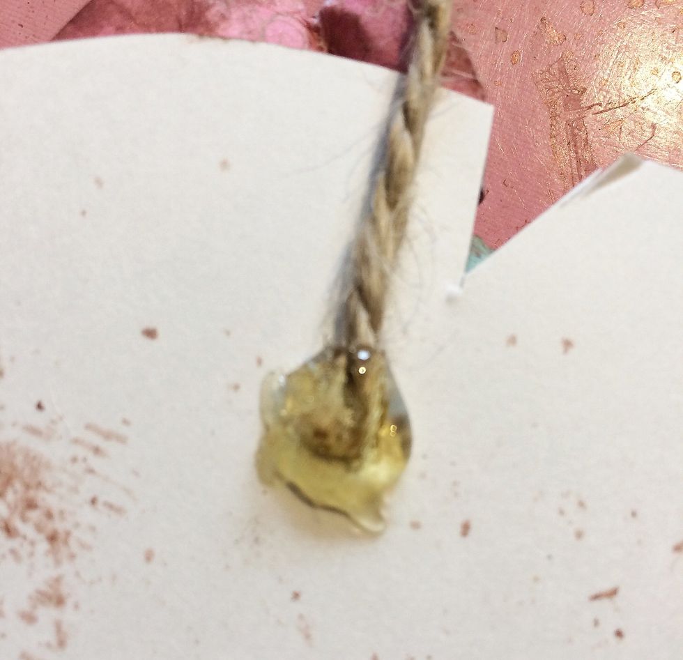 To hang your wings, use your hot glue to adhere a rope or ribbon to the back. From the front, there were a few places were you could still see the white poster board, so I simply trimmed them out.