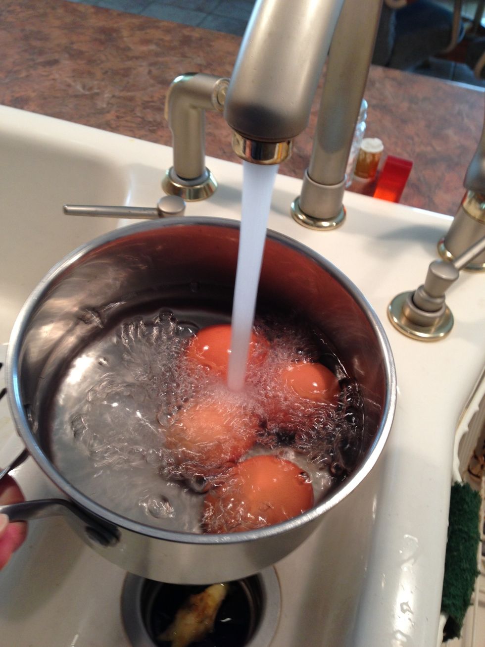 To hard cook egg..., cover eggs with water in saucepan.