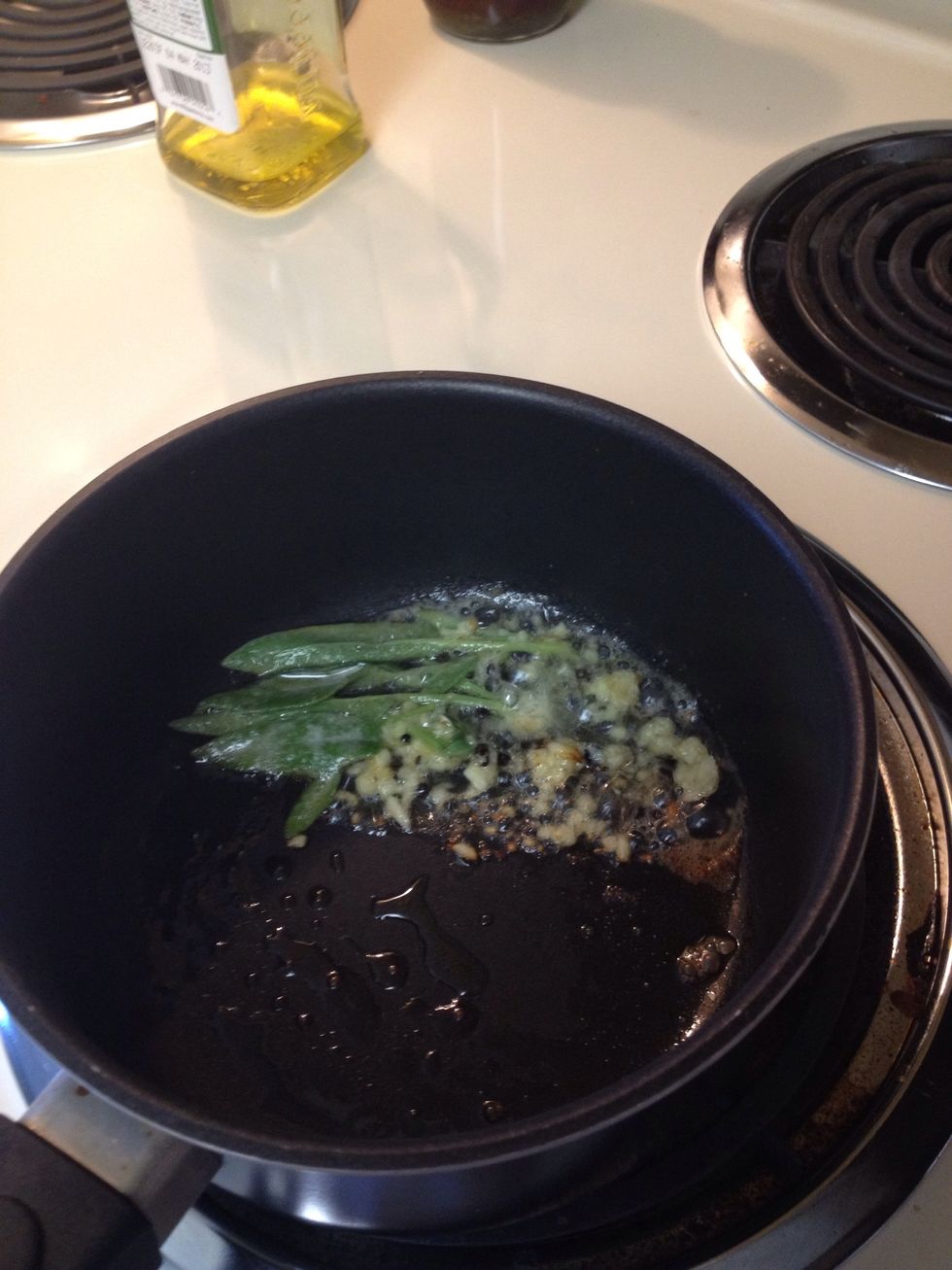 To hot oil and butter, over medium heat, add the herbs, peppercorn, garlic, and lemon juice