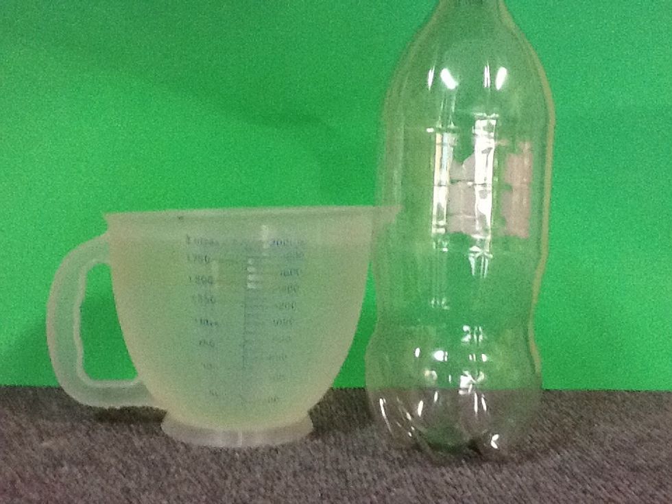 To illustrate clearing dirty water, a brief experiment was done. The empty soda bottle is filled with two liters of clear tap water.