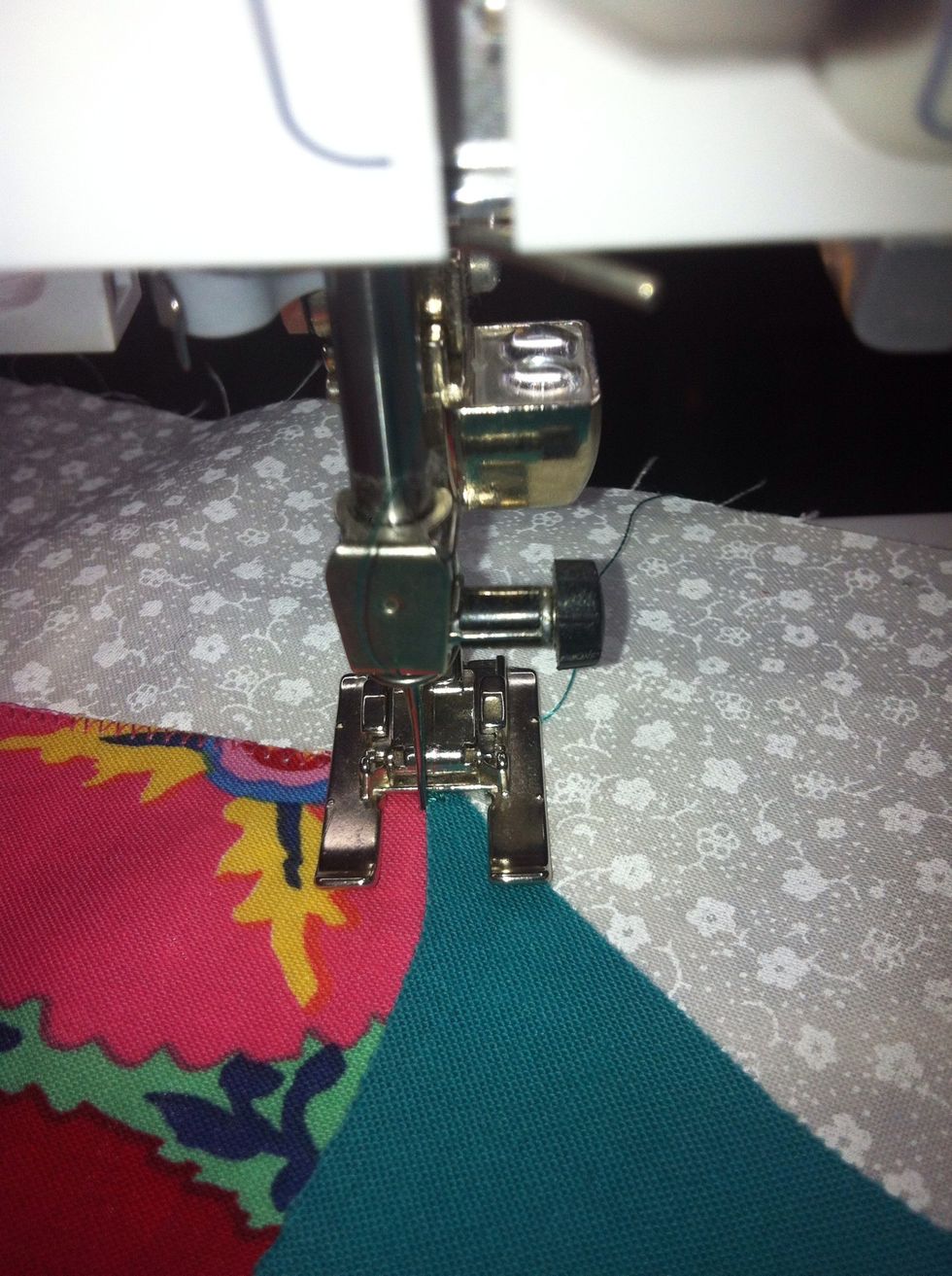 To just past its edge. Note now the needle is hitting another part of the appliqu\u00e9 instead of the background. See how the fabric curves? Follow that edge.