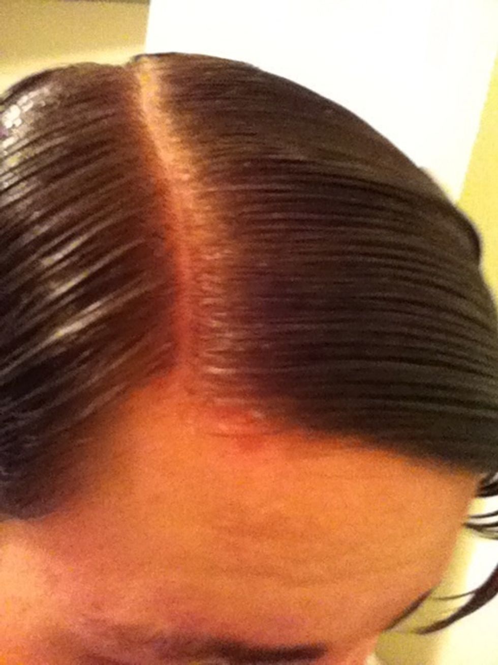 To keep hairs in place you may use your non-dominant hand to hold one side of the part down while combing the other side with the dominant hand.