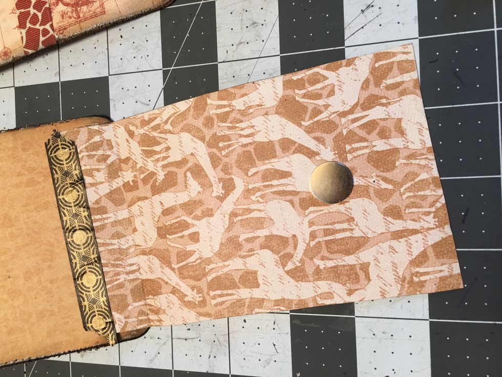 To keep the flap closed down on to the tag, place another large magnet snap (+positive) in the center of the flap on the back side about 1 1/2" down from the cut edge.