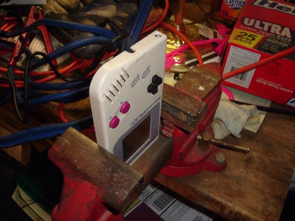 To keep the gameboy steady when drilling, i put it into a vice. It was a hard decision whether long or short way was the best position. Do what seems best for your situation.