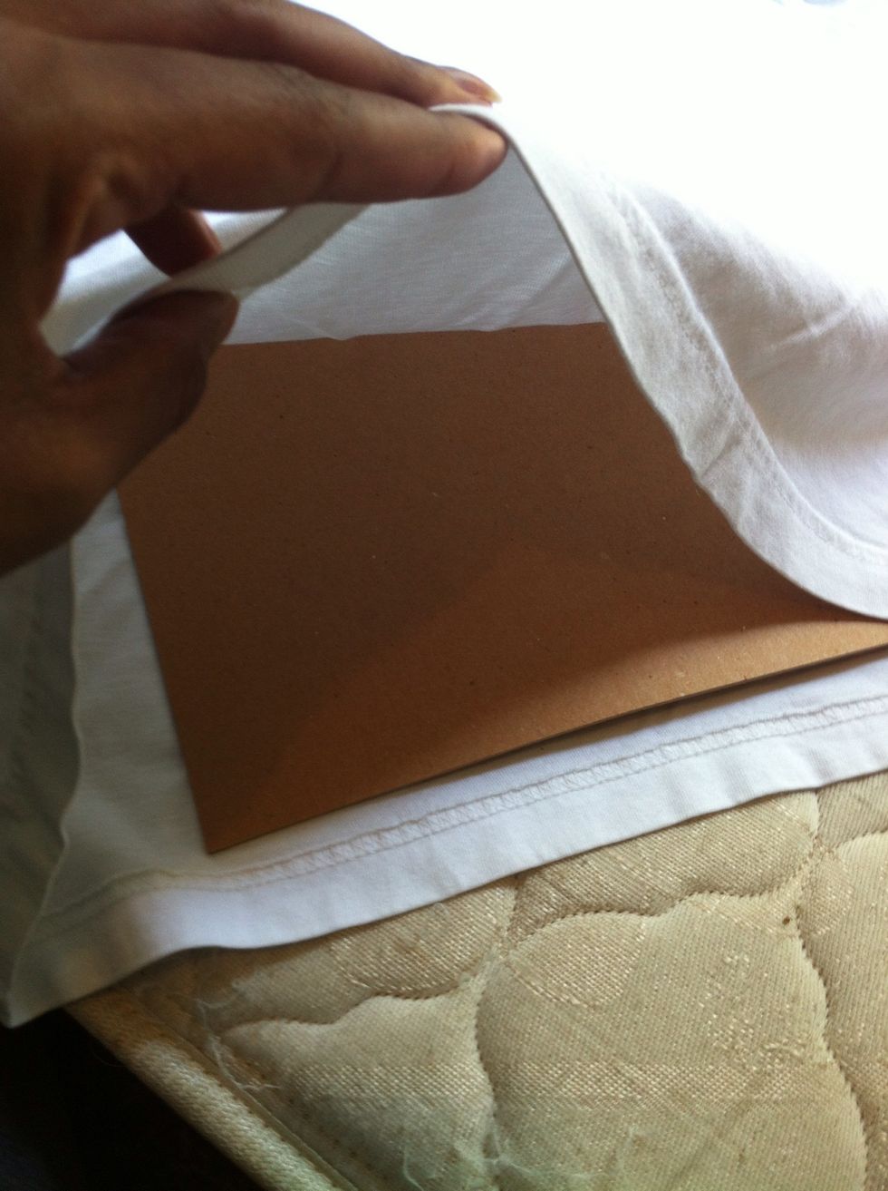 To keep the paint from bleeding through the shirt, place the piece of cardboard inside. *A scrap piece works just fine*