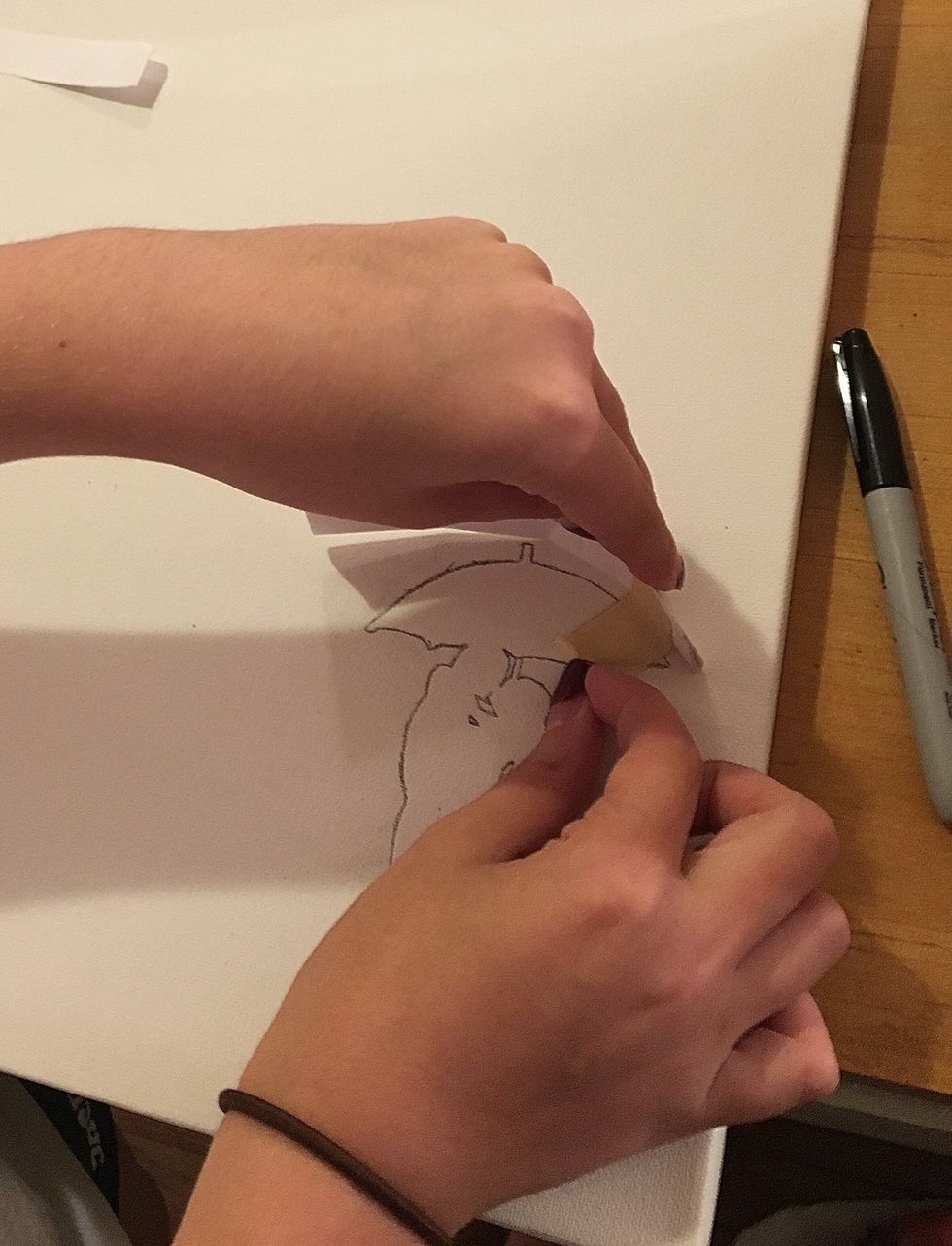 To keep the silhouette protected from the crayons you'll need to cover 2 flashcards in cling wrap and tape them to the canvas in the shape of the umbrella.