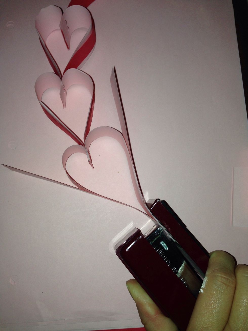 To make a heart with two colors. Add 2 additional strips of paper to each side with desired colors. Stapling 4 strips instead of 2.