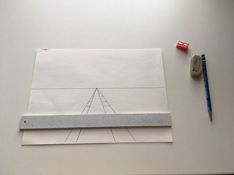 To make a sidewalk, keep your ruler parallel to your horizon line.  The spaces get smaller and closer together as they near the vanishing point.