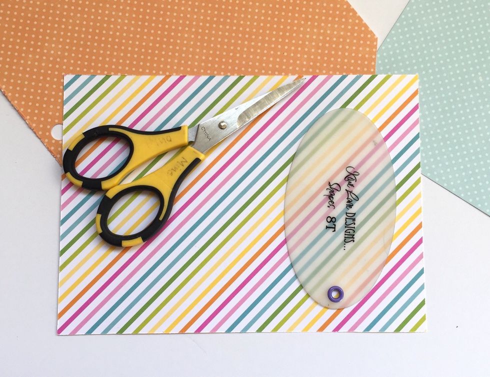 To make an Easter Egg shell, trace the large oval from the Tiny Shapes template set and then ink the edges.