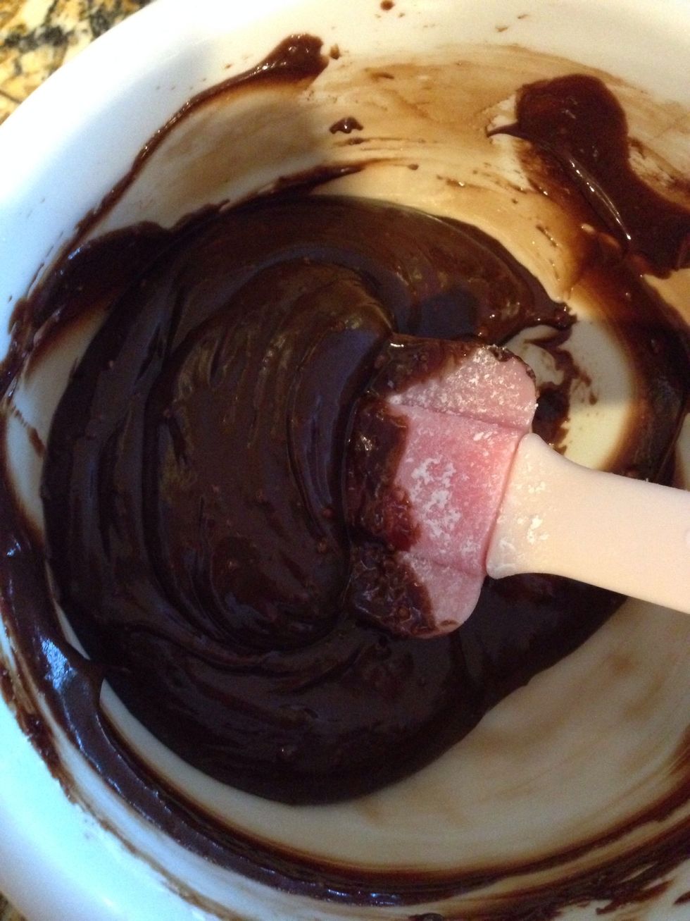 To make chocolate glaze, melt chocolate chips and butter. Add powdered sugar and vanilla, and beat with a spoon until creamy. Then carefully pipe on to the cream filled eclairs!