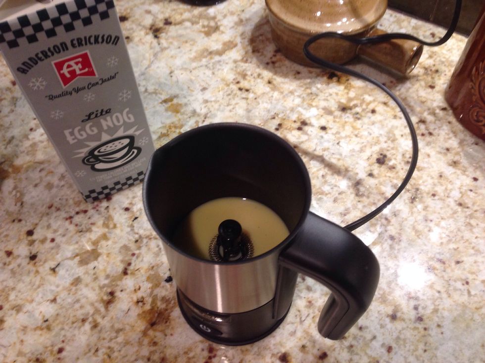 To make egg nog froth, pour 1/8 cup of egg nog into the bottom of the frother. Just enough to flavor the milk.