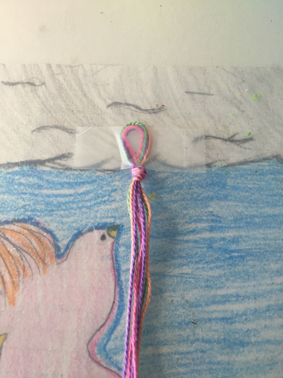 To make is easier I taped down the string