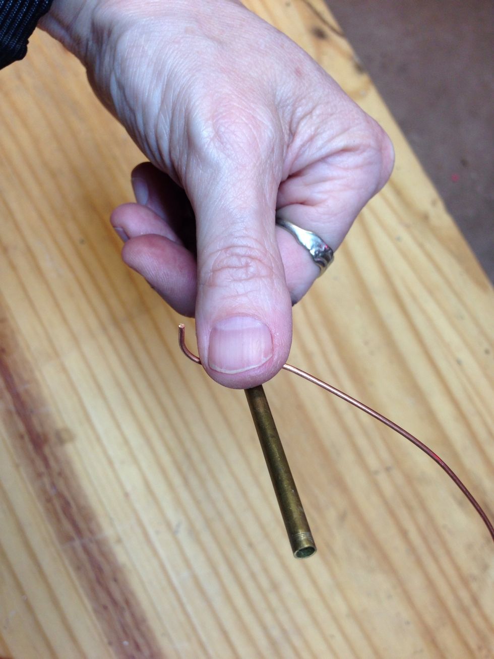To make jump rings, wrap about a foot of wire around something thinner than a pencil, maybe a knitting needle, or a chopstick, or it can be done on a round nose pliers. I start with a 1" thumb grip.