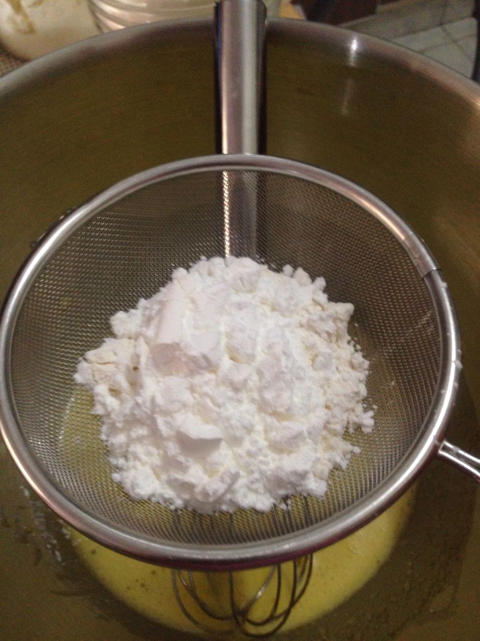 To make pastry cream, whisk egg yolk and sugar together until pale, then sift in the flour + cornstarch to the egg mixture and mix until you get smooth paste