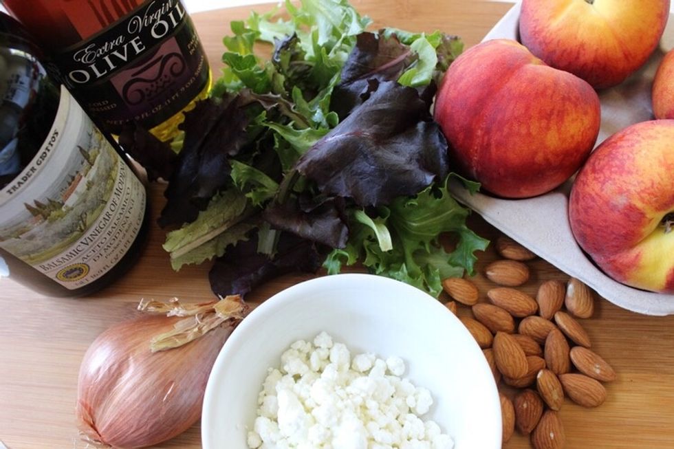 To make prep easier, start off by plating the mixed greens, minced shallots, & goat cheese. Then set aside.