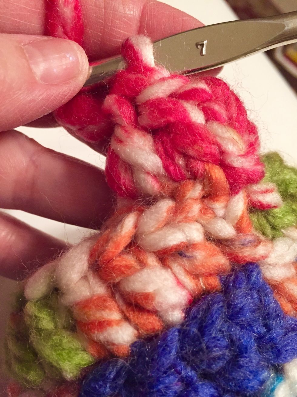 to make strap: do not tie off yarn. chain 3, then double crochet in top of next 2 stitches. turn, then chain 3, double in top of next stitch and top of chain 3. turn and repeat.