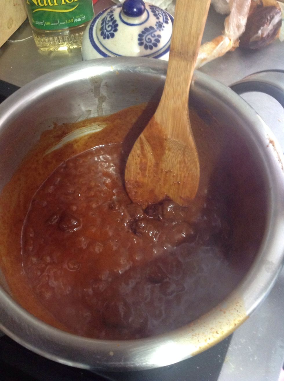 To make the adobo, get some dry chilies ( guajillo) onion, garlic, let it cook whit water, once it's cook, blend it and put it back in the pan, add the chicharon, vinegar and oregano, season it