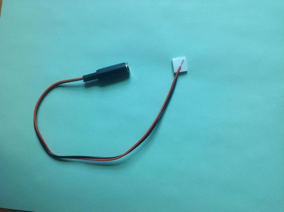 To make the battery interrupter: Peel the paper from a foam dot.  Take the jack and place one of the wires on one side of the dot and the other wire on the other side of the dot.