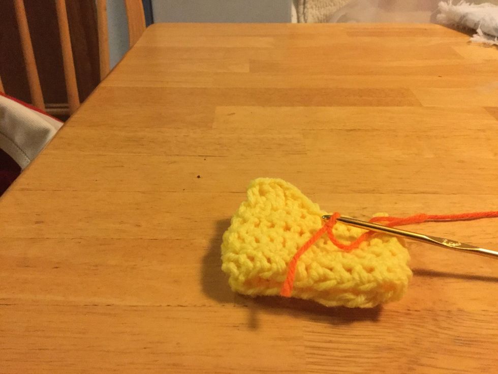 To make the beak use F hook and a contrasting color yarn. Leave a long tail on yarn and don't work in end.