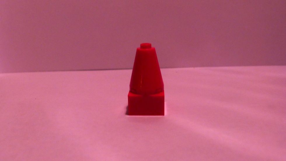 To make the "bow" of the box connect the 2x2 cone on top of a thick 2x2.