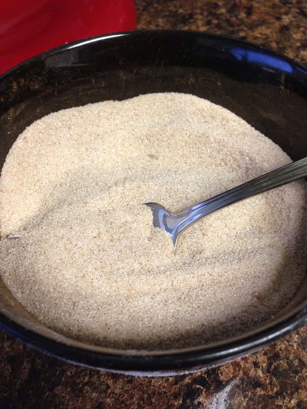 To make the coating, combine the sugar and cinnamon. And melt the butter in a bowl or glass pan.