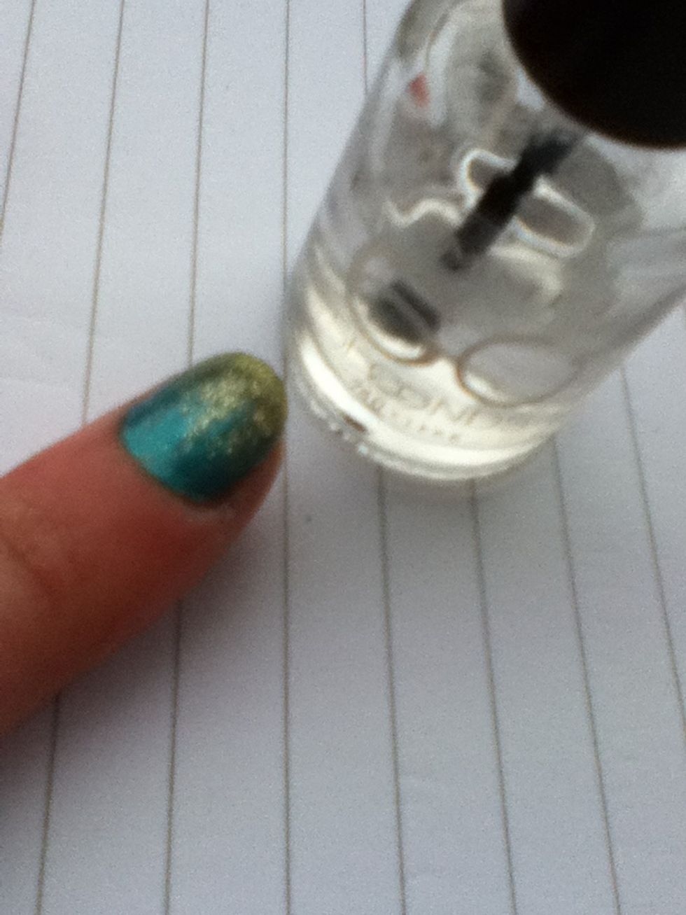 To make the design last longer, you can paint clear nail varnish on top.