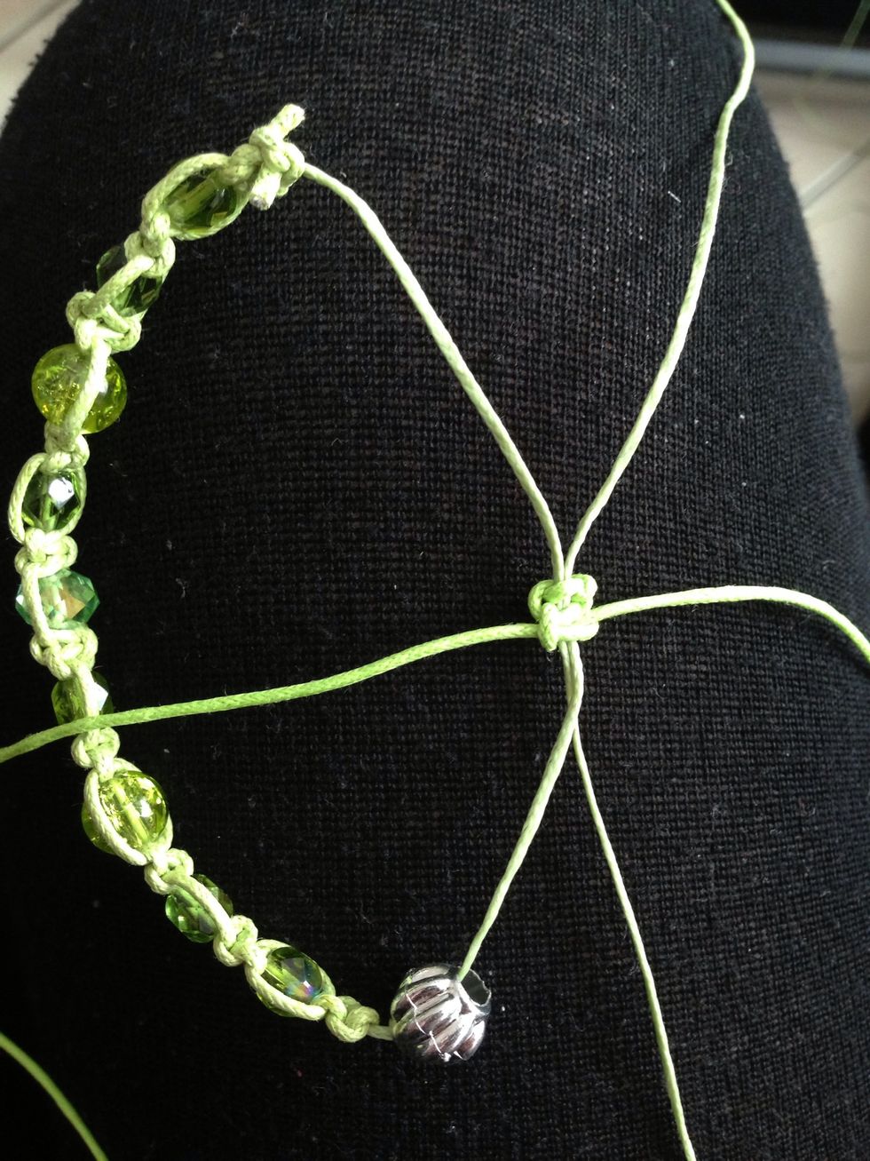 To make the ends together make the same knots. Cross the 2 end ropes over each other. Start to make the knots...