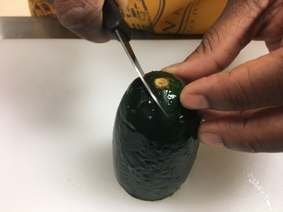 To make the feathers for the top of the swan, slant your knife and cut at the top so that the cut will be slanted and curved.