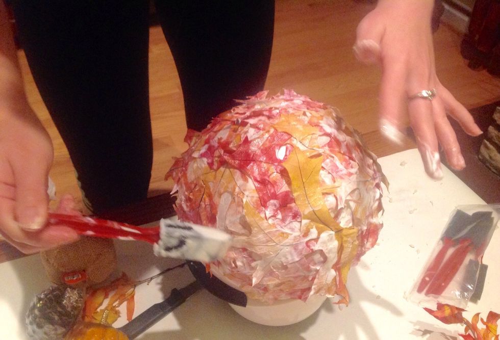 To make the leaf bowl, use the same steps from the jar to cover the balloon in leaves. Put Mod Podge on the balloon and leaf. Make sure to paint over the already secured leaves with extra Mod Podge.